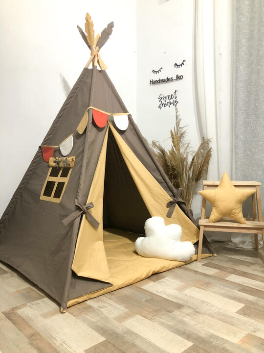 Childrens tent set with brown, mustard-colored bedding.
